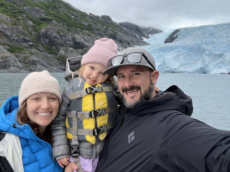 John Doherty with his wife and daughter at a glacier
